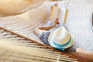 Male Reading in Hammock Summer reading