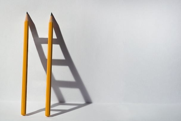 Pencils with Ladder Shadow Demonstrating How Your Job Benefits from Imagination Storytelling Concept