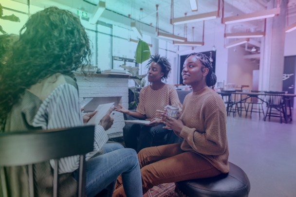 group of interns meeting in an open office setting